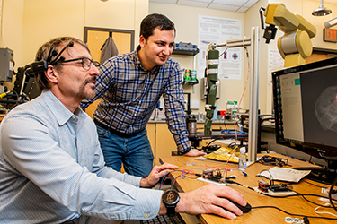 Lyle School Professor Edmond Richer in lab