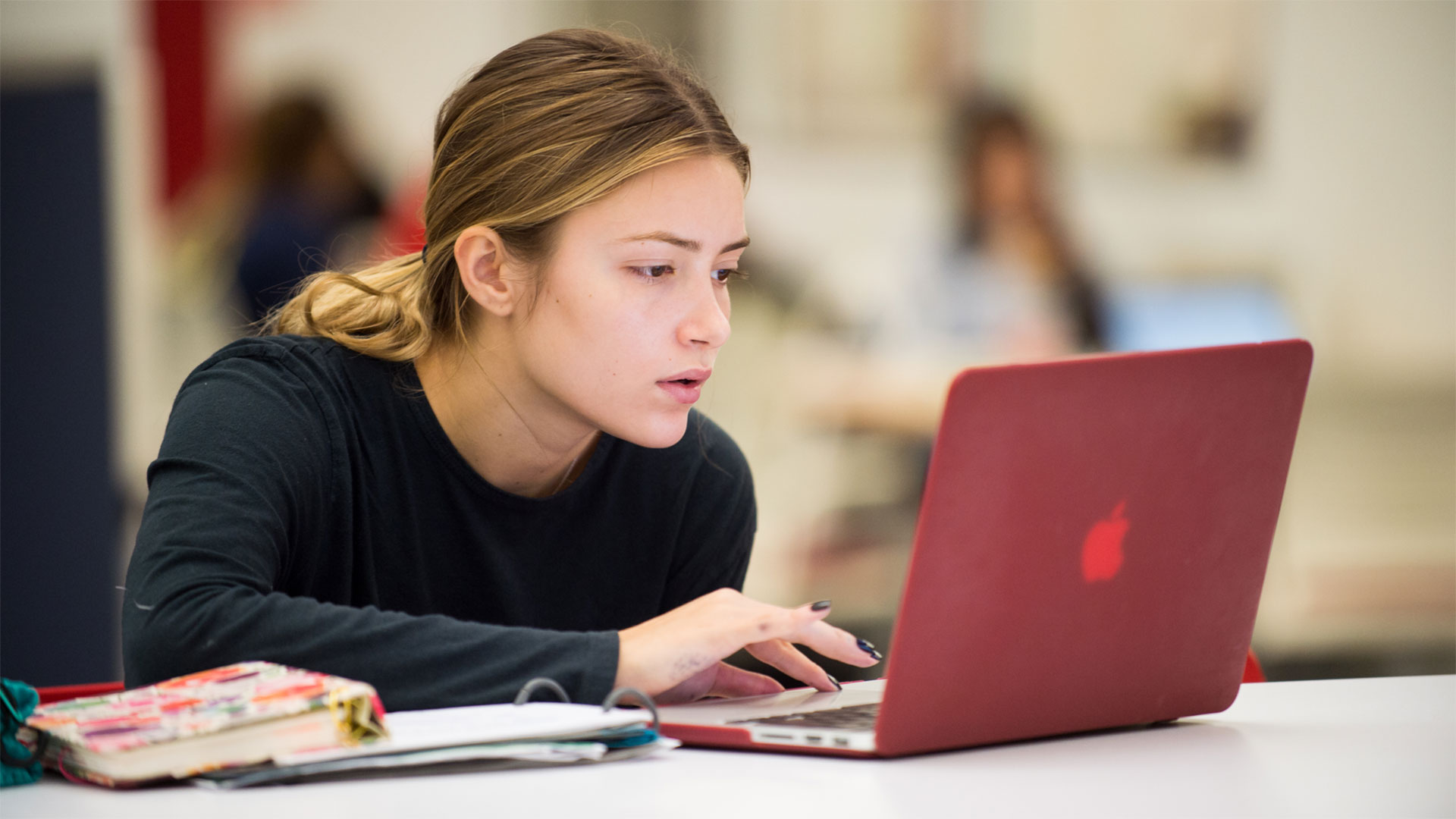 A student working in her laptop.
