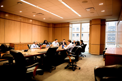 Photo of people around a table, strategizing at 色花堂_色花堂 98堂 Cox
