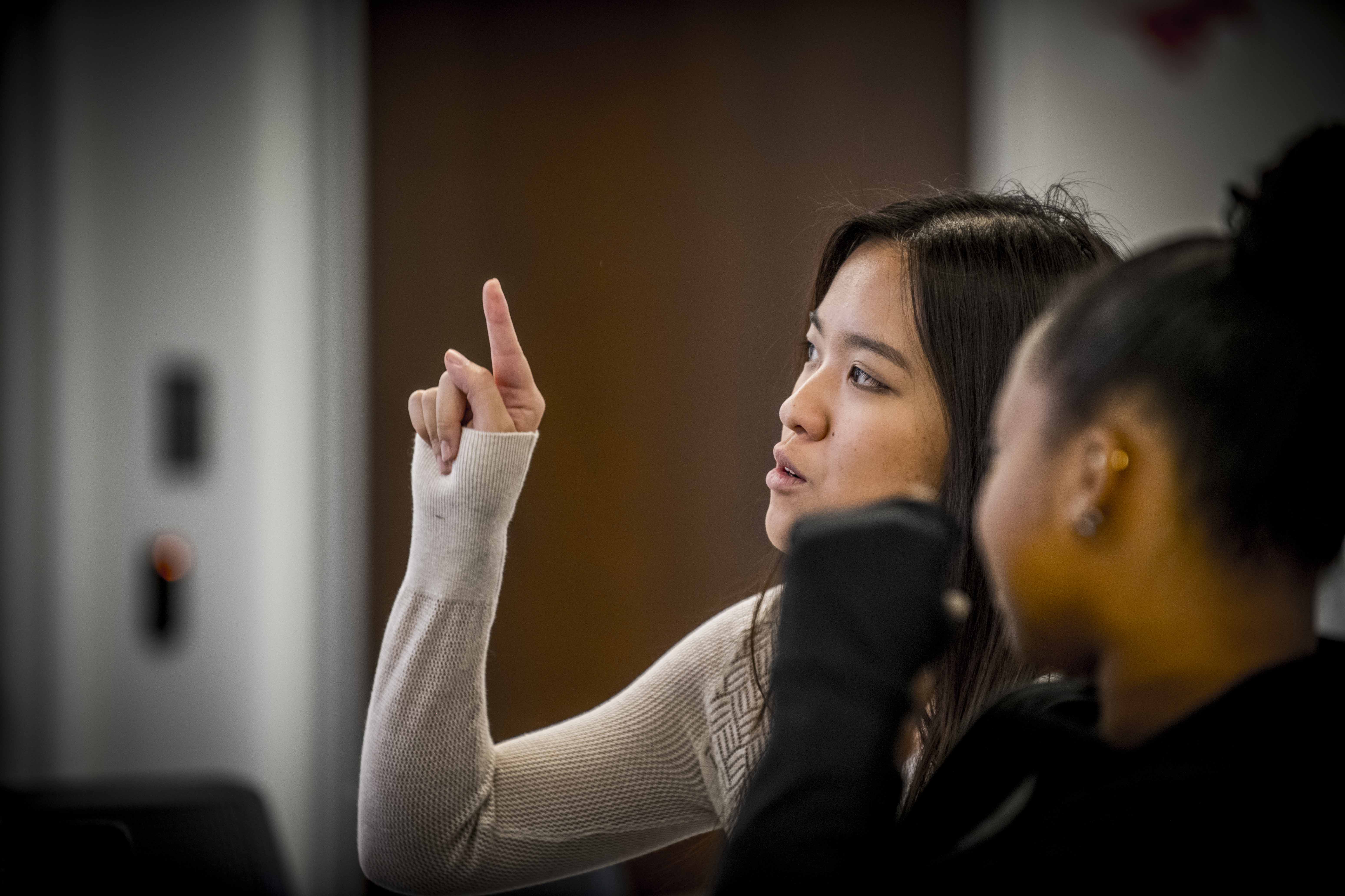 student raising hand