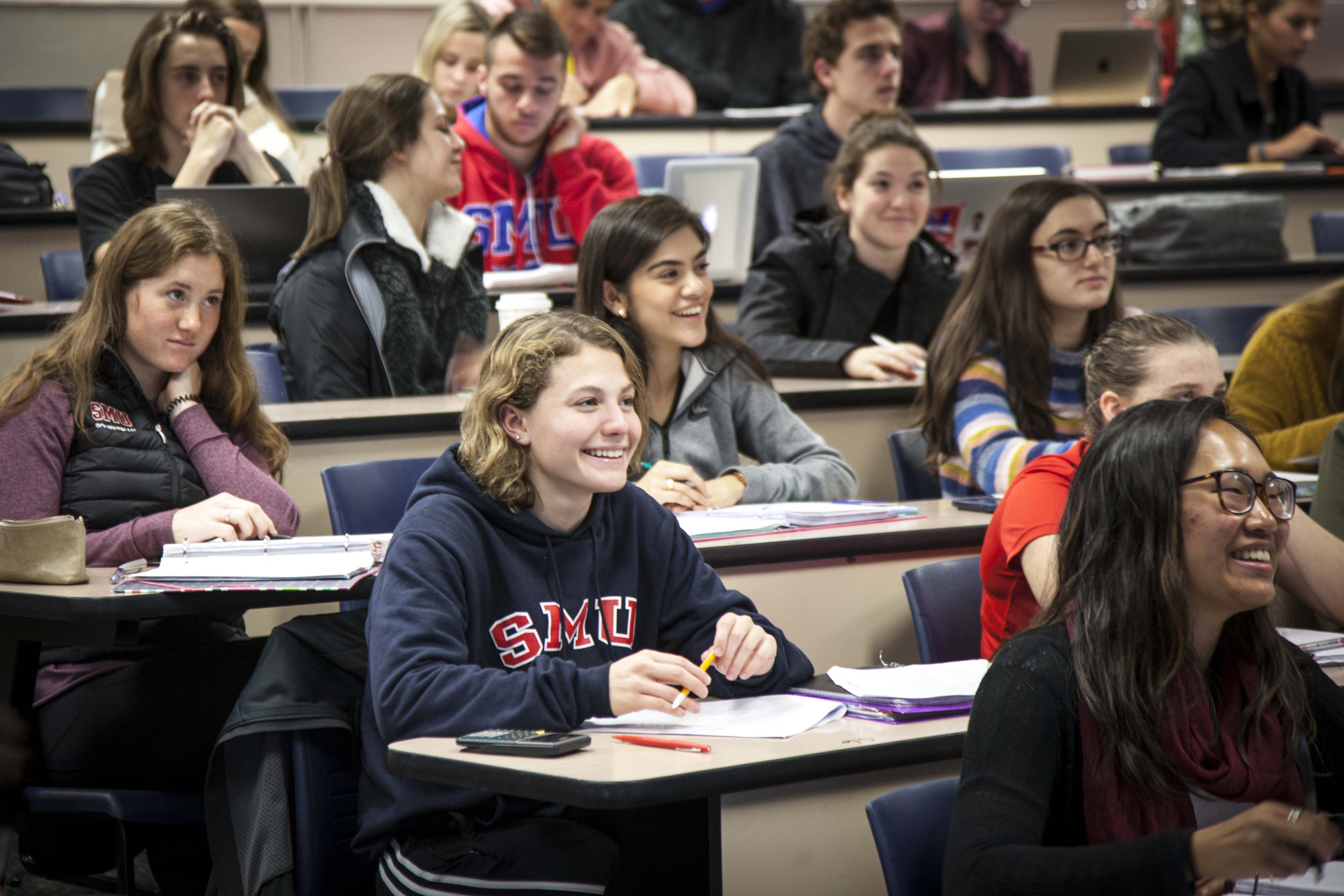 students smiling in class