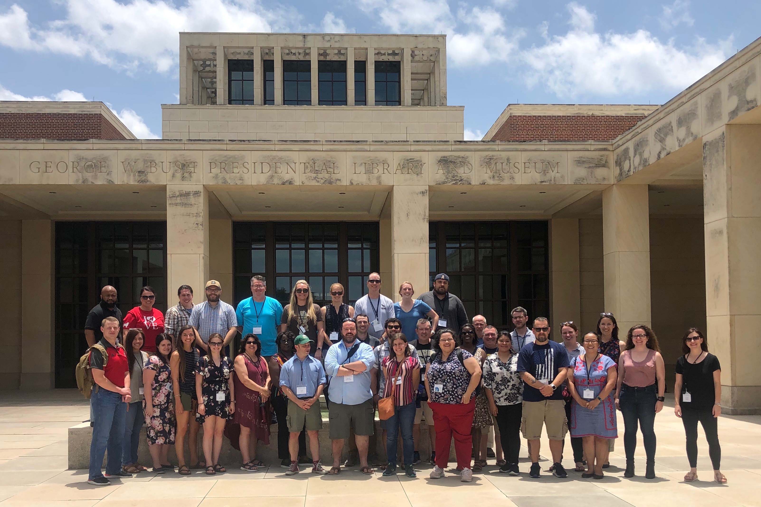 group shot in front of Bush Center