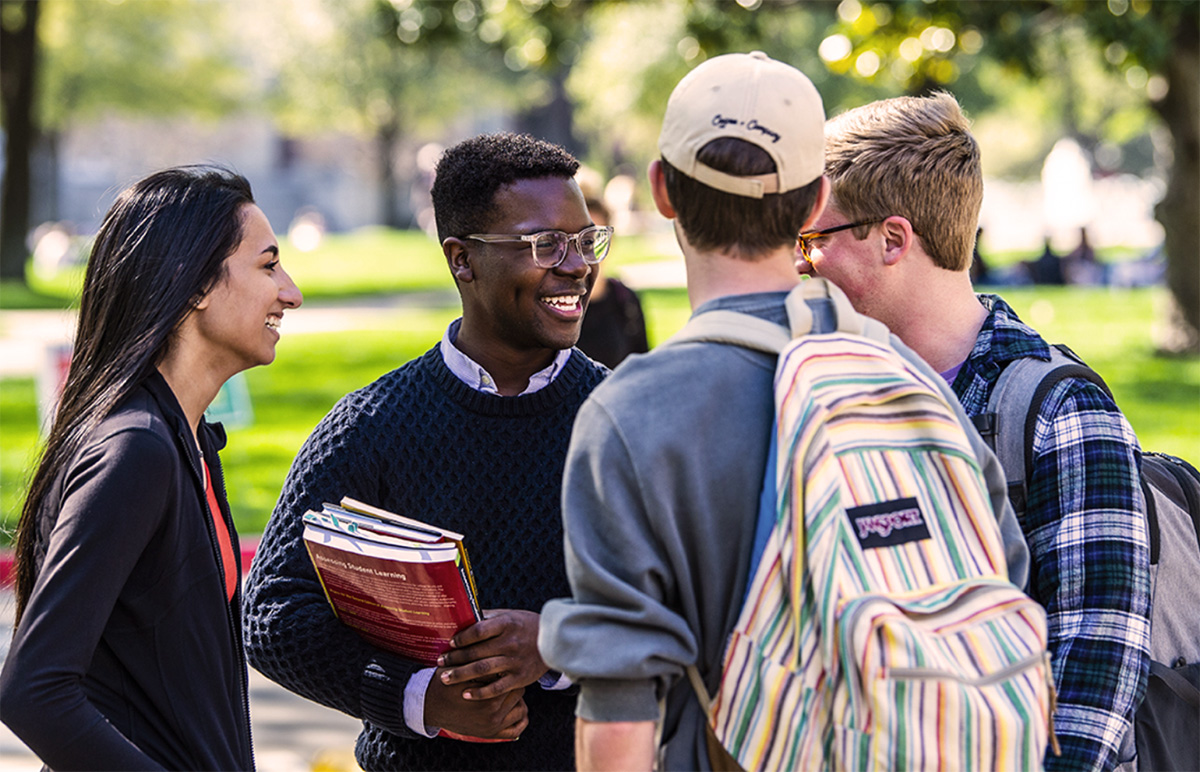 Photo of students having a conversation.