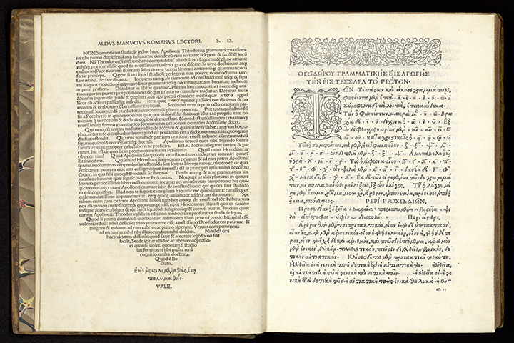 An open Greek book. The left page of text narrows as it goes down the page. The right page has a floral top border and decorated initial.