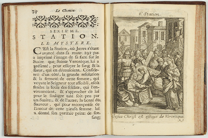 A French meditation book open to the seventh station with a woodcut of Veronica wiping Jesus' face with an imprint of his face on the cloth.