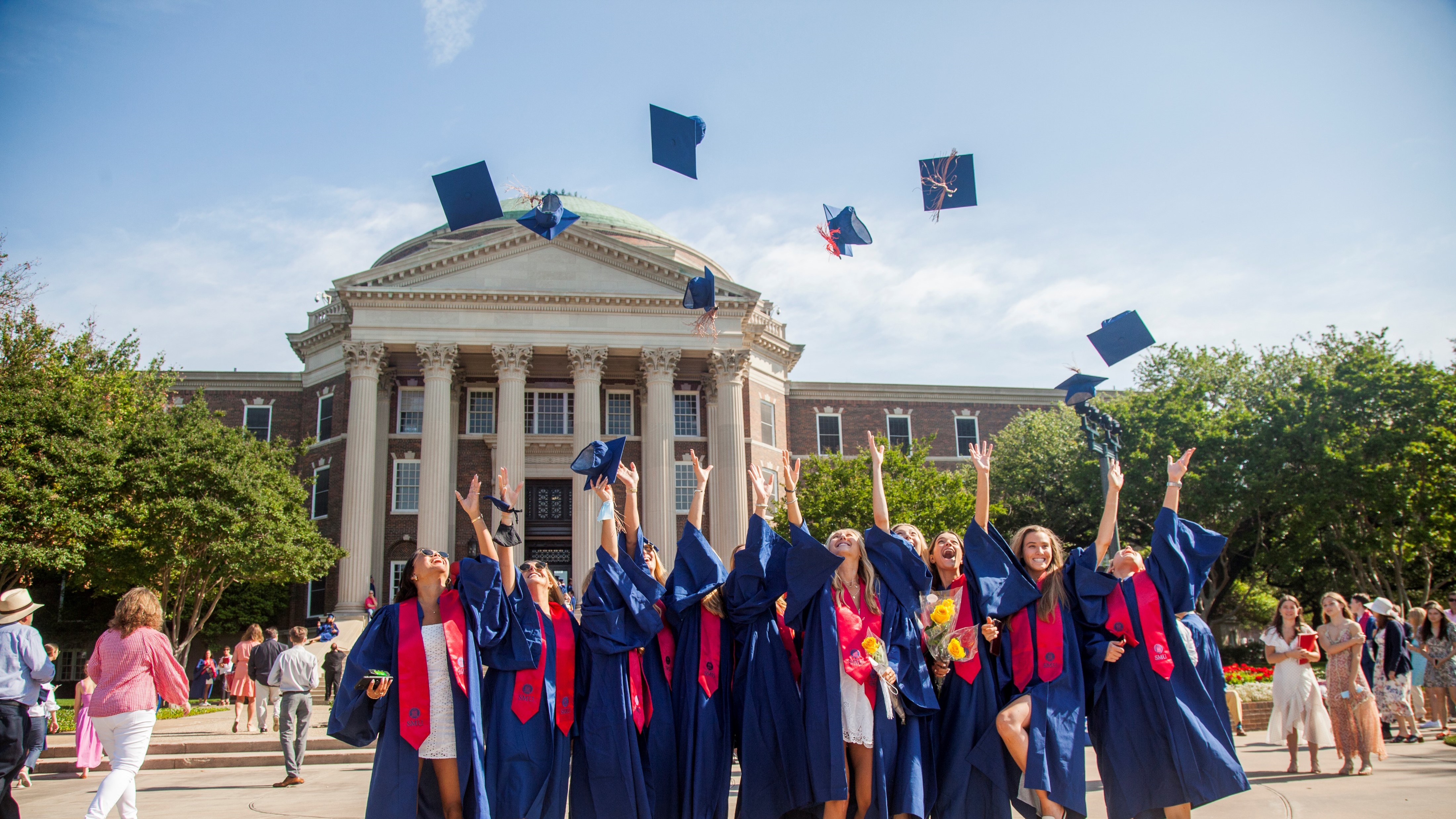 graduates throwing hats