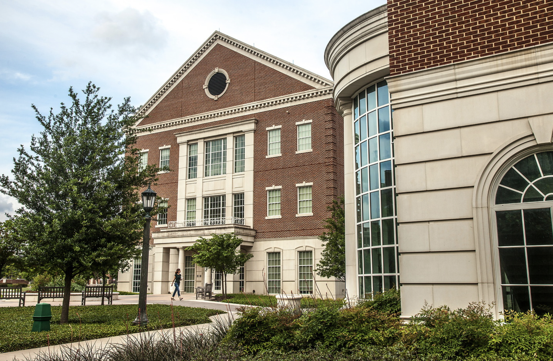 The Annette Caldwell School of Education and Human Development, two brick buildings surrounded by green lawn and trees
