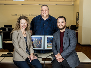 Dr. Ketterlin Geller, Dr. Corey Clark, and Dr. Eric Larson seated together in computer lab